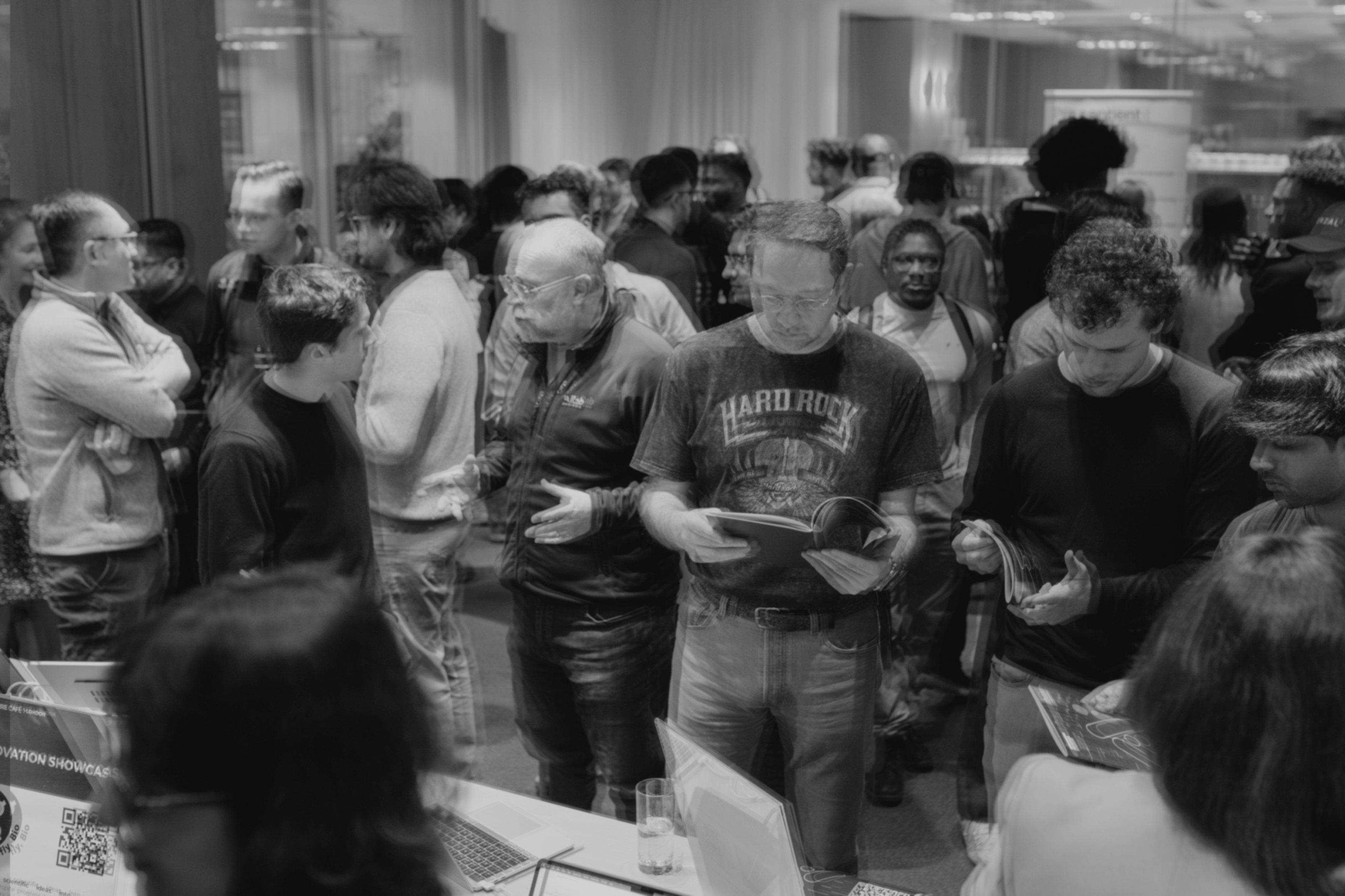 A crowd of researchers moving through an AI for science showcase